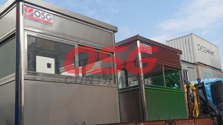 Two modern guard booths with windows, parked outdoors.