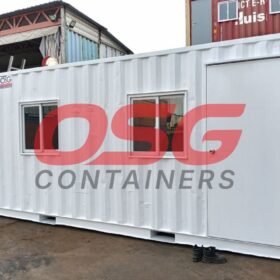 White shipping container office with windows and a door.