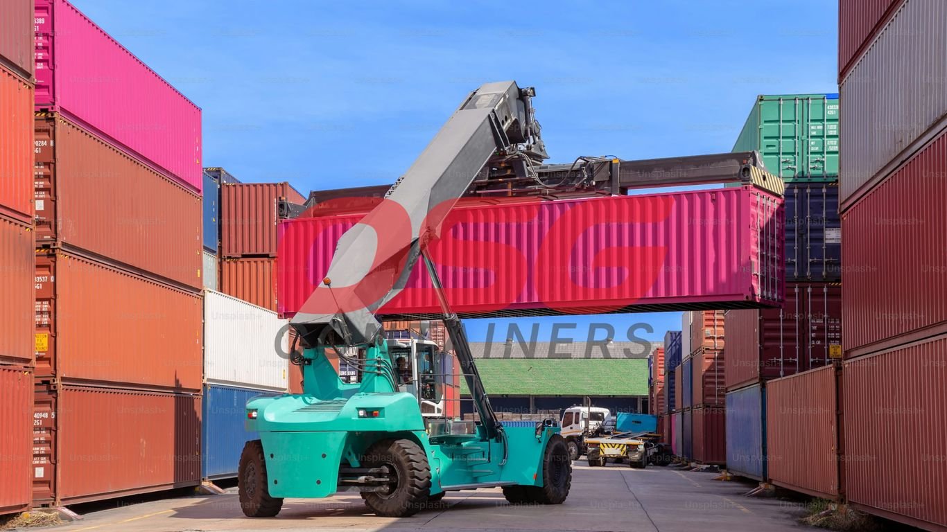 A crane lifts a pink shipping container at a busy port.