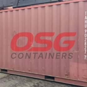 A large red shipping container with OSG Containers logo.
