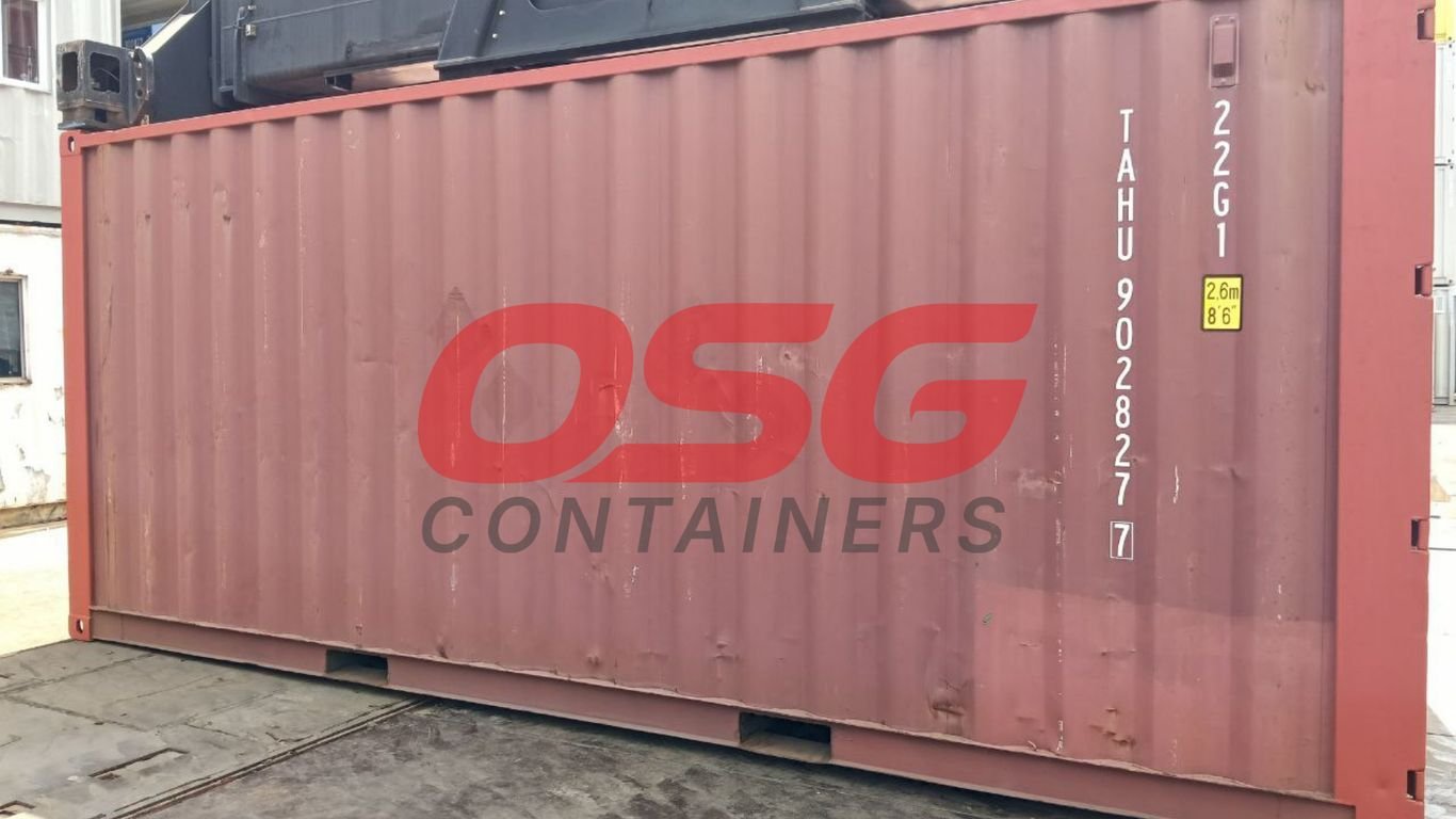 A large red shipping container with OSG Containers logo.