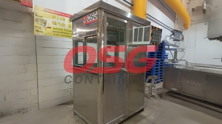 A stainless steel guard booth with windows and an air conditioner.