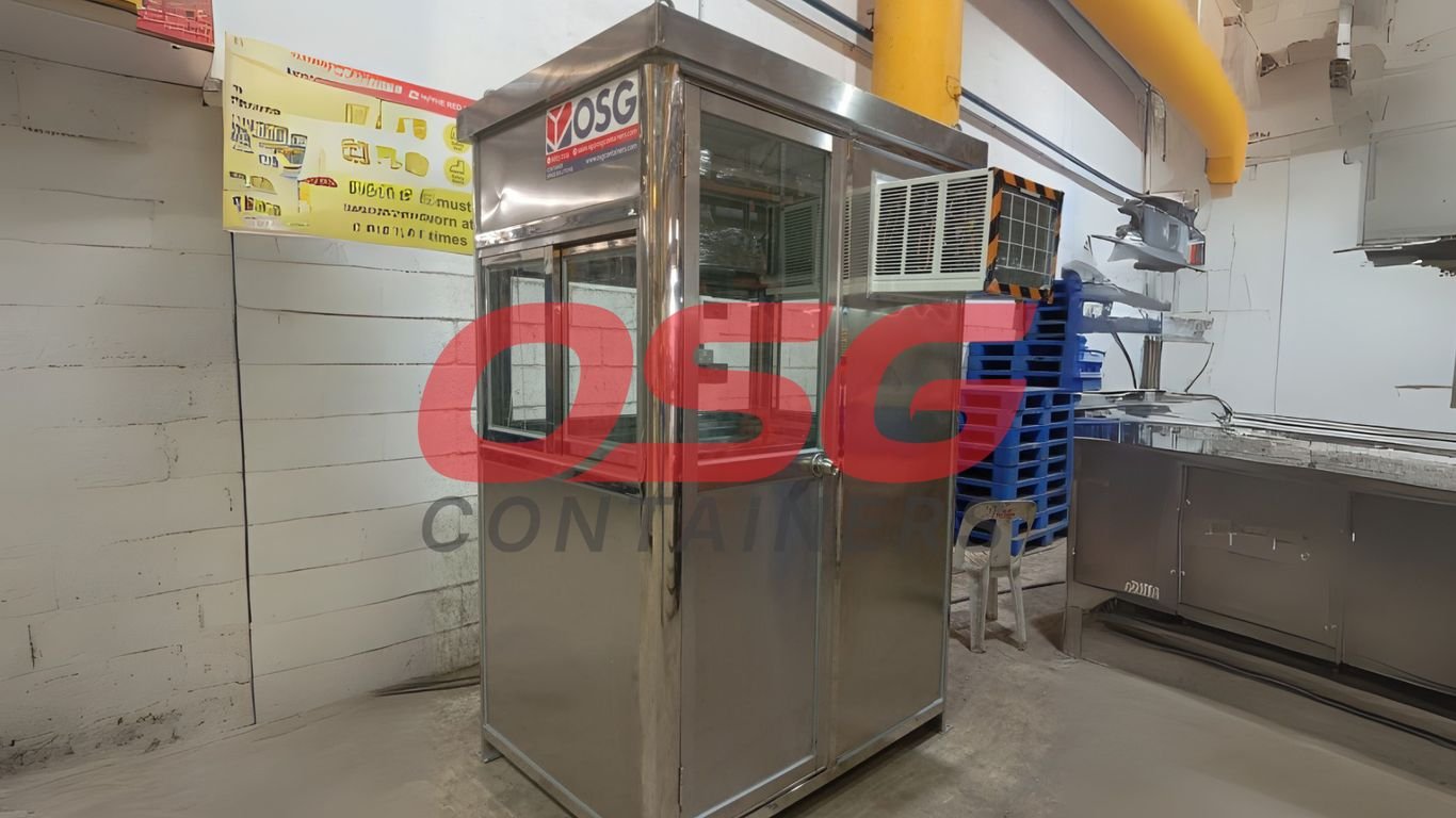A stainless steel guard booth with windows and an air conditioner.