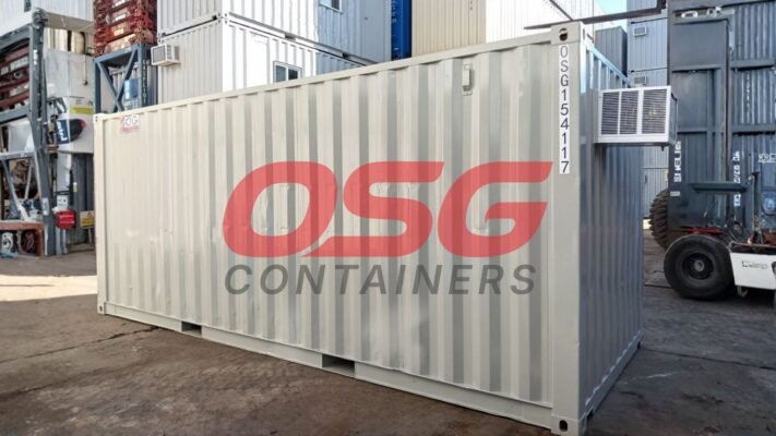 OSG containers stacked with an air conditioning unit attached.