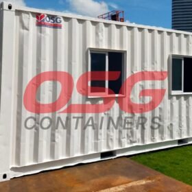 White shipping container office with windows and door.